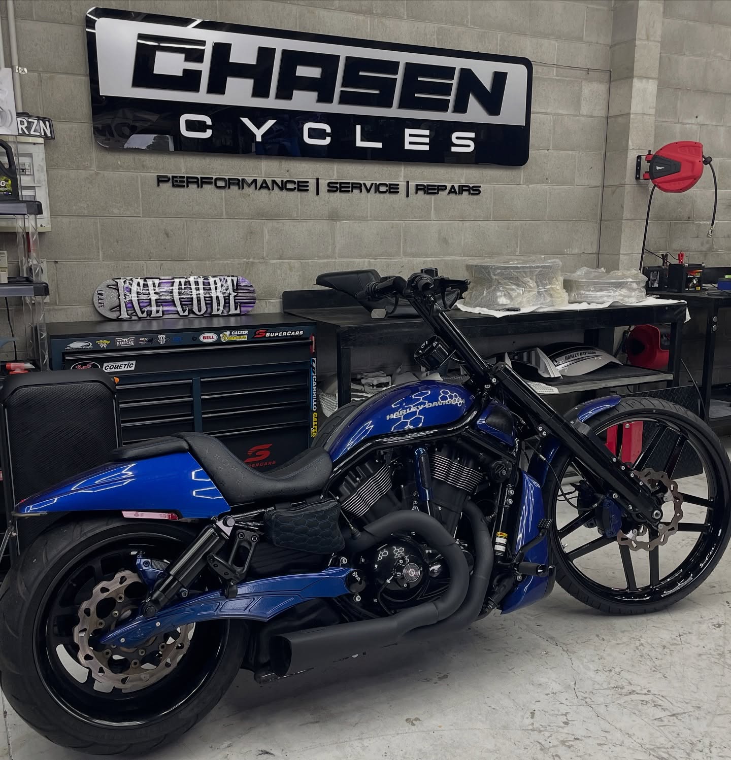 Electric blue Harley V-Rod Night Rod with honeycomb tank and wide rear wheel
