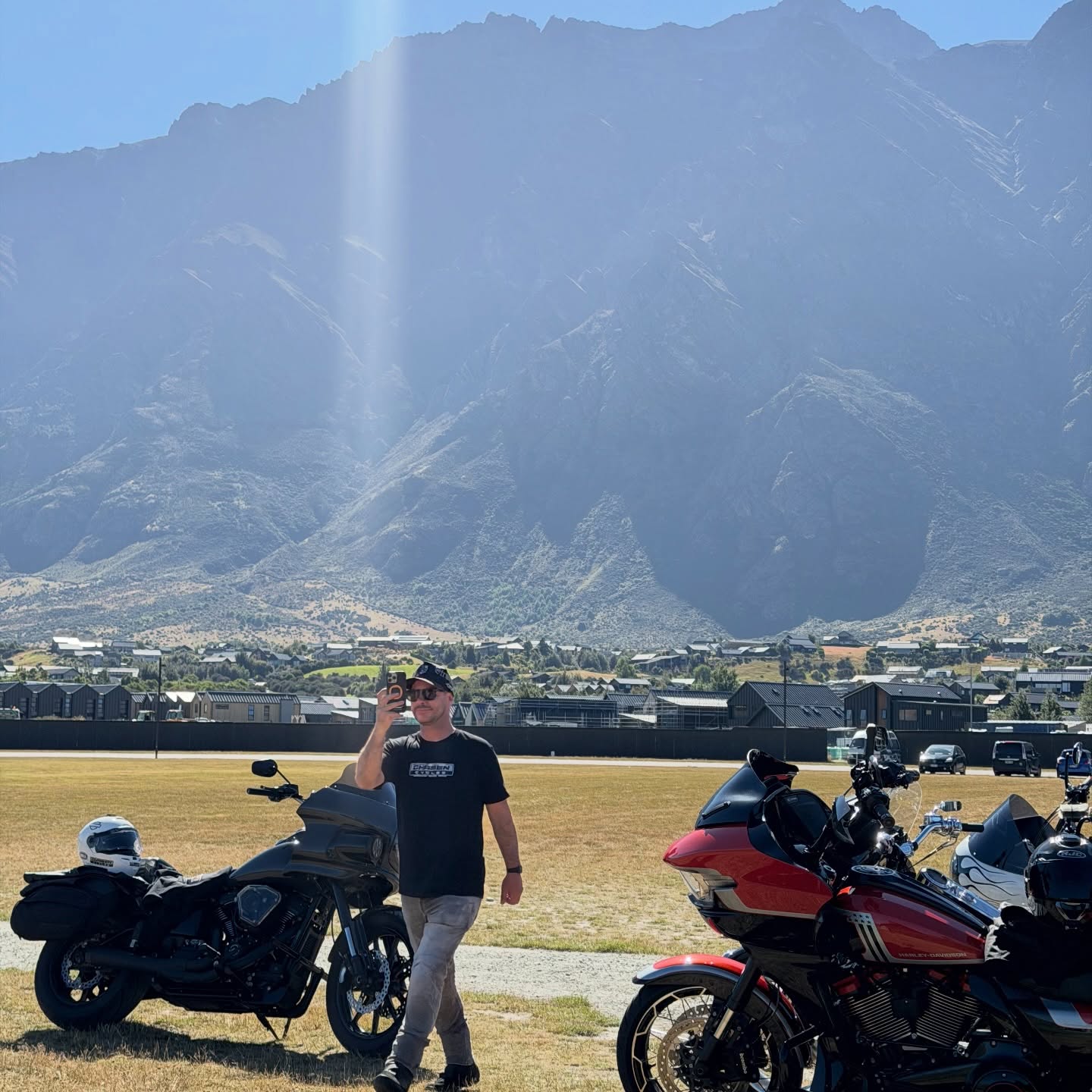 Bikes lined up, mountain backdrop